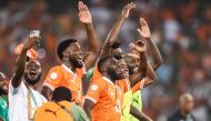 Ivory Coast's players celebrate after winning at the end of the Africa Cup of Nations (CAN) 2024 semi-final football match at Alassane Ouattara Olympic Stadium in Ebimpe, Abidjan on February 7, 2024. (Photo by Franck Fife / AFP)