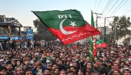 Supporters of Pakistan Tehreek-e-Insaf (PTI) party protest outside the office of a Returning Officer in Peshawar on February 9, 2024, against the alleged rigging in Pakistan's national election results. (Photo by Abdul MAJEED / AFP)
