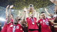 Qatar's fans celebrate with a giant banner after their team won the AFC Qatar 2023 Asian Cup final at the Lusail Stadium in Lusail, on February 10, 2024. (Photo by KARIM JAAFAR / AFP)