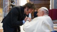 This handout photograph taken on February 11, 2024 and released by the Vatican press office, Vatican Media, shows Pope Francis (R) greeting Argentine President Javier Milei (L) at the Vatican. (Photo by Handout / VATICAN MEDIA / AFP)
