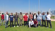 QCB Governor H E Sheikh Bandar bin Mohammed bin Saud Al Thani, QIIB CEO Dr Abdulbasit Ahmad Al Shaibei with employees at the celebration of National Sport Day.