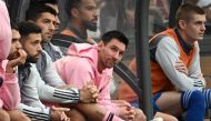 Inter Miami's Argentine forward Lionel Messi (C) sits on the bench during the friendly football match on February 4, 2024. (Photo by Peter Parks / AFP)

