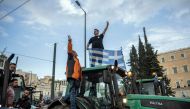 Greek farmers take part in a protest to demand financial aid in front of the Parliament in Athens on February 20, 2024. (Photo by Angelos TZORTZINIS / AFP)
