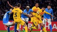 Napoli's Nigerian forward #09 Victor Osimhen (C) vies for the ball during the UEFA Champions League round of 16 first Leg football match between Napoli and Barcelona at the Diego-Armando-Maradona stadium in Naples on February 21, 2024. (Photo by Tiziana FABI / AFP)

