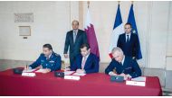 Deputy Prime Minister and Minister of State for Defense Affairs H E Dr. Khalid bin Mohammed 
Al Attiyah (left, standing) and Minister of the Armed Forces of France H E Sebastien Lecornu look on as officials sign documents in Paris. 