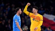 Barcelona's Polish forward #09 Robert Lewandowski (R) celebrates after scoring a goal during the UEFA Champions League round of 16 first Leg football match between Napoli and Barcelona at the Diego-Armando-Maradona stadium in Naples on February 21, 2024. Photo by Tiziana FABI / AFP