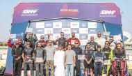 The podium winners of the second round of Qatar National Sprint pose for a photograph with officials.