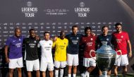 Former Paris Saint-Germain stars pose with the winner's trophy ahead of the Legends Tour by Visit Qatar, in Doha.