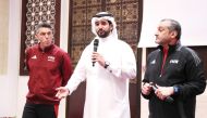 QFA Secretary-General Mansour Al Ansari speaks during the opening ceremony of FIFA seminar yesterday. QFA Arbitration Department Hani Taleb Ballan (right) and FIFA Arbitration Department Executive Director Massimo Busacca are also present.   
