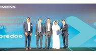 Ooredoo official receiving an award during the Siemens Partner Day.