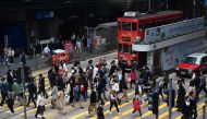 People cross an intersection at Hong Kong business district. File photo for representational purposes only.