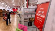(FILES) A 'now hiring' sign is displayed in a retail store in Manhattan on January 05, 2024 in New York City. Hiring in the US stayed robust in February while unemployment crept up, US Department of Labor data showed on March 8, 2024. (Photo by SPENCER PLATT / GETTY IMAGES NORTH AMERICA / AFP)
