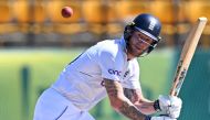 England's captain Ben Stokes watches the ball after playing a shot during the third day of the fifth and last Test cricket match between India and England at the Himachal Pradesh Cricket Association Stadium in Dharamsala on March 9, 2024. (Photo by Sajjad Hussain / AFP)