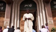 A man prays in front of the Lagos Central Mosque in Lagos on March 8, 2024, ahead of the holy fasting month of Ramadan. (Photo by Benson Ibeabuchi / AFP)
