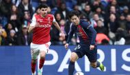 Paris Saint-Germain's South Korean midfielder #19 Lee Kang-in fights for the ball with Reims' Belgian defender #25 Thibault De Smet during the French L1 football match between Paris Saint-Germain (PSG) and Stade de Reims at the Parc des Princes stadium in Paris on March 10, 2024. (Photo by FRANCK FIFE / AFP)