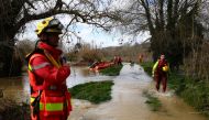 Rescuers take part in searching operations of seven missing persons on the Gardon river in Russan, on March 10, 2024 following heavy rain over south-eastern France. (Photo by CLEMENT MAHOUDEAU / AFP)
