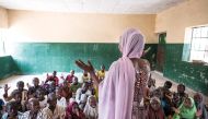 IRC learning facilitator Fatima teaches out of school children in Maiduguri, northeast Nigeria, as part of EAAEACIRC’s Education in Emergencies programming.