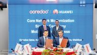 Aziz Aluthman Fakhroo, Group MD and CEO of Ooredoo  and Li Peng, President of ICT Sales and Services of Huawei, along with other officials during the signing ceremony.