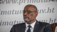 File: Haitian Prime Minister Ariel Henry looks on during a ceremony at La Primature in Port-au-Prince, Haiti, on July 20, 2021. (Photo by Valerie Baeriswyl / AFP)

