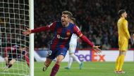 Barcelona's Spanish midfielder #20 Sergi Roberto celebrates a goal scored by Barcelona's Polish forward #09 Robert Lewandowski (L) during the UEFA Champions League last 16 second leg football match between FC Barcelona and SSC Napoli at the Estadi Olimpic Lluis Companys in Barcelona on March 12, 2024. (Photo by LLUIS GENE / AFP)
