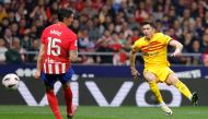 Barcelona's Polish forward #09 Robert Lewandowski scores his team's second goal during the Spanish league football match between Club Atletico de Madrid and FC Barcelona at the Metropolitano stadium in Madrid on March 17, 2024. (Photo by OSCAR DEL POZO / AFP)
