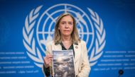 World Meteorological Organization (WMO) Secretary-General Celeste Saulo poses with the WMO's 2023 global climate report prior to a press conference in Geneva, on March 19, 2024. (Photo: Fabrice Coffrini / AFP)