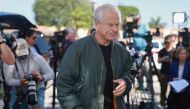 Former Donald Trump adviser Peter Navarro walks away after holding a press conference before turning himself into a federal prison on March 19, 2024, in Miami, Florida. (Photo by JOE RAEDLE / GETTY IMAGES NORTH AMERICA / Getty Images via AFP)
