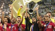 Qatar’s captain Hassan Al Haydos lifts the AFC Asian Cup Qatar 2023 trophy as his team celebrates during the podium ceremony, in this February 10 file photo. AFP

