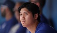 Shohei Ohtani #17 of the Los Angeles Dodgers looks on in the dugout during a game against the Chicago White Sox at Camelback Ranch on February 27, 2024 in Glendale, Arizona. (Photo by Christian Petersen / GETTY IMAGES NORTH AMERICA / Getty Images via AFP)