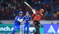 Sunrisers Hyderabad's Abhishek Sharma (R) plays a shot as Mumbai Indians' wicketkeeper Ishan Kishan fields during the Indian Premier League (IPL) Twenty20 cricket match between Sunrisers Hyderabad and Mumbai Indians at the Rajiv Gandhi International Stadium in Hyderabad on March 27, 2024. (Photo by Noah SEELAM / AFP)
