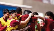 Qatar's Almoez Ali (centre) celebrates with teammates after scoring his team's second goal against Kuwait on Tuesday.