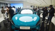 Chinese smartphone maker Xiaomi's first electric car, Xiaomi SU7 model, is seen at a shop in Hangzhou, in eastern China's Zhejiang province on March 25, 2024. (Photo by AFP)
