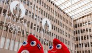A photograph taken in Saint-Denis, north of Paris on March 28, 2024, shows two official Olympic Phryges mascots for the Paris 2024 Summer Olympic and Paralympic Games displayed at headquarters of the Paris 2024 Olympics and Paralympics Organizing Committee (Cojo). (Photo by Joel Saget / AFP)