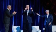 Former US President Barack Obama (left) and former US President Bill Clinton (right) cheer for US President Joe Biden during a campaign fundraising event at Radio City Music Hall in New York City on March 28, 2024. (Photo by Brendan Smialowski / AFP)
