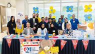 Staff of Al Maha Specialized Pediatric Care Center during the World Down Syndrome Day.