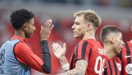 Al Rayyan's Roger Guedes (centre) celebrates with teammates after the match.
