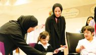Minister of Education and Higher Education H E Buthaina bint Ali Al Jabr Al Nuaimi interacts with children at Al-Hidayah School for People with Special Needs in Al Sakhama.
