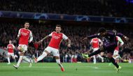 Bayern Munich's German midfielder #07 Serge Gnabry (R) shoots the ball during the UEFA Champions League quarter final first-leg football match between Arsenal and Bayern Munich at the Arsenal Stadium, in north London, on April 9, 2024. (Photo by Adrian DENNIS / AFP)