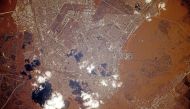 This handout photograph taken on April 11, 2024 by Russia's cosmonaut Oleg Kononenko from aboard the International Space Station (ISS) and released by the Russian Roscosmos space agency shows the flood-hit city of Orenburg. (Photo by Handout / ROSCOSMOS / AFP)