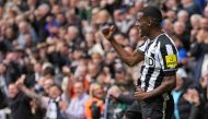 Newcastle United's Swedish striker #14 Alexander Isak celebrates after scoring their third goal during the English Premier League football match between Newcastle United and Tottenham Hotspur at St James' Park in Newcastle-upon-Tyne, north east England on April 13, 2024. (Photo by Andy Buchanan / AFP) 