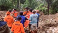 This handout photo released on April 14, 2024 by the National Search and Rescue Agency (BASARNAS) shows rescuers carrying a body bag at a landslide site in Tana Toraja, South Sulawesi. At least 19 people have been found dead and two more are missing after a landslide in central Indonesia, local authorities said on April 14. (Photo by Handout / BASARNAS / AFP)