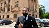 Moiz Jaaferi, a lawyer challenging the ban on social media platform X, talks to local media after a hearing at the Sindh High Court in Karachi on April 17, 2024. (Photo by Asif Hassan / AFP)