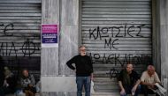 People take part in a demonstration in central Athens on April 17, 2024, after labor unions in Greece called a 24-hour nationwide strike to protest against the rise of the cost of living. (Photo by Aris MESSINIS / AFP)