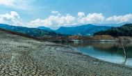 View showing the low water level of the Guavio reservoir that feeds the Guavio Hydroelectric Power Plant in Gachala, Cundinamarca Department, Colombia, on April 16, 2024. (Photo by Jhojan Hilarion / AFP)