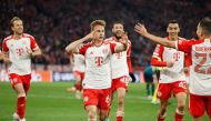 Bayern Munich's German midfielder #06 Joshua Kimmich (center) celebrates scoring the opening goal with his teammates during the UEFA Champions League quarter-final second leg football match between FC Bayern Munich and Arsenal FC in Munich, southern Germany on April 17, 2024. (Photo by Odd Andersen / AFP)