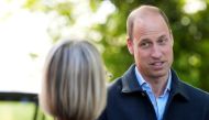 Britain's Prince William, Prince of Wales is greeted as he arrives for a visit to Surplus to Supper, a surplus food redistribution charity, in Sunbury-on-Thames, Surrey, England, on April 18, 2024. (Photo by Alastair Grant / POOL / AFP)
