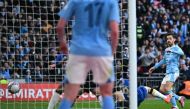 Manchester City's Portuguese midfielder #20 Bernardo Silva (R) scores the opening goal of the English FA Cup semi-final football match between Manchester City and Chelsea at Wembley Stadium in north west London on April 20, 2024. (Photo by Ben Stansall / AFP) 