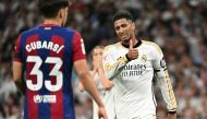 Real Madrid's English midfielder #5 Jude Bellingham gives a thumb up during the Spanish league football match between Real Madrid CF and FC Barcelona at the Santiago Bernabeu stadium in Madrid on April 21, 2024. (Photo by JAVIER SORIANO / AFP)
