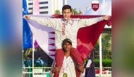 Qatar’s gold medal winner Rakan Rashidi lifts teammate Hamza Hashem, bronze medal winner, on his shoulders after dominating   the triple jump event.   