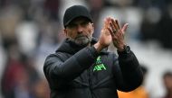 Liverpool's German manager Jurgen Klopp applauds fans on the pitch after the English Premier League football match between West Ham United and Liverpool at the London Stadium, in London on April 27, 2024. The game ended 2-2. (Photo by Ben Stansall / AFP)